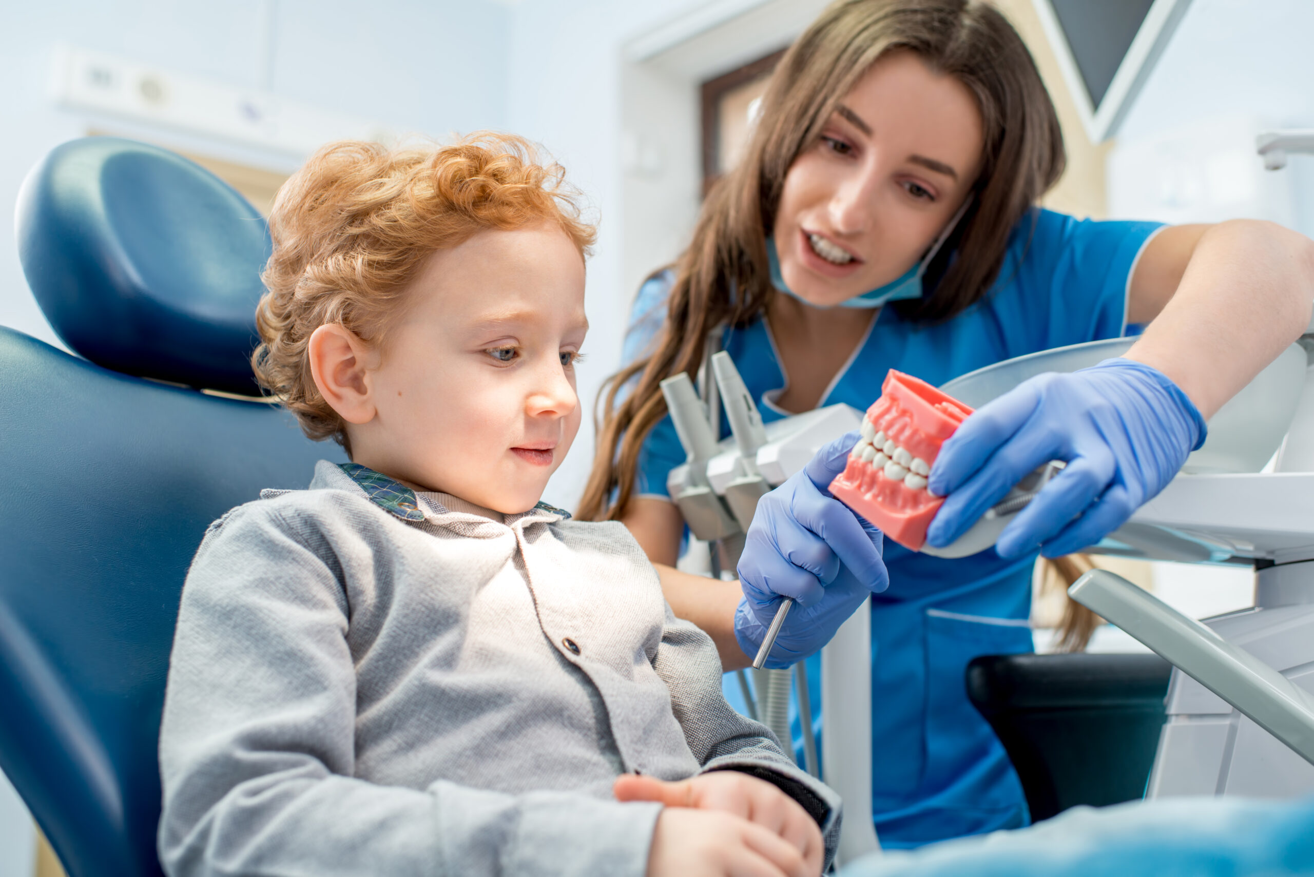 Dentist with boy at the dental office Dental Phobia Image 2